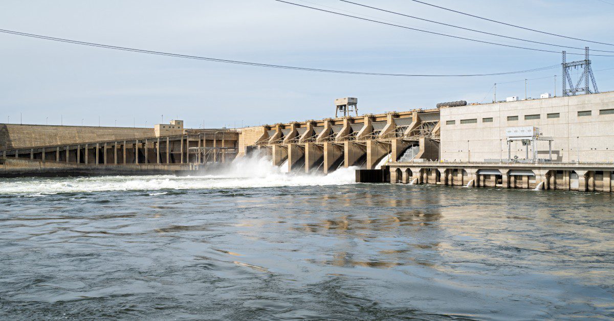 The Ice Harbor Dam on the Snake River is open, releasing a large flow of water through its concrete structure.